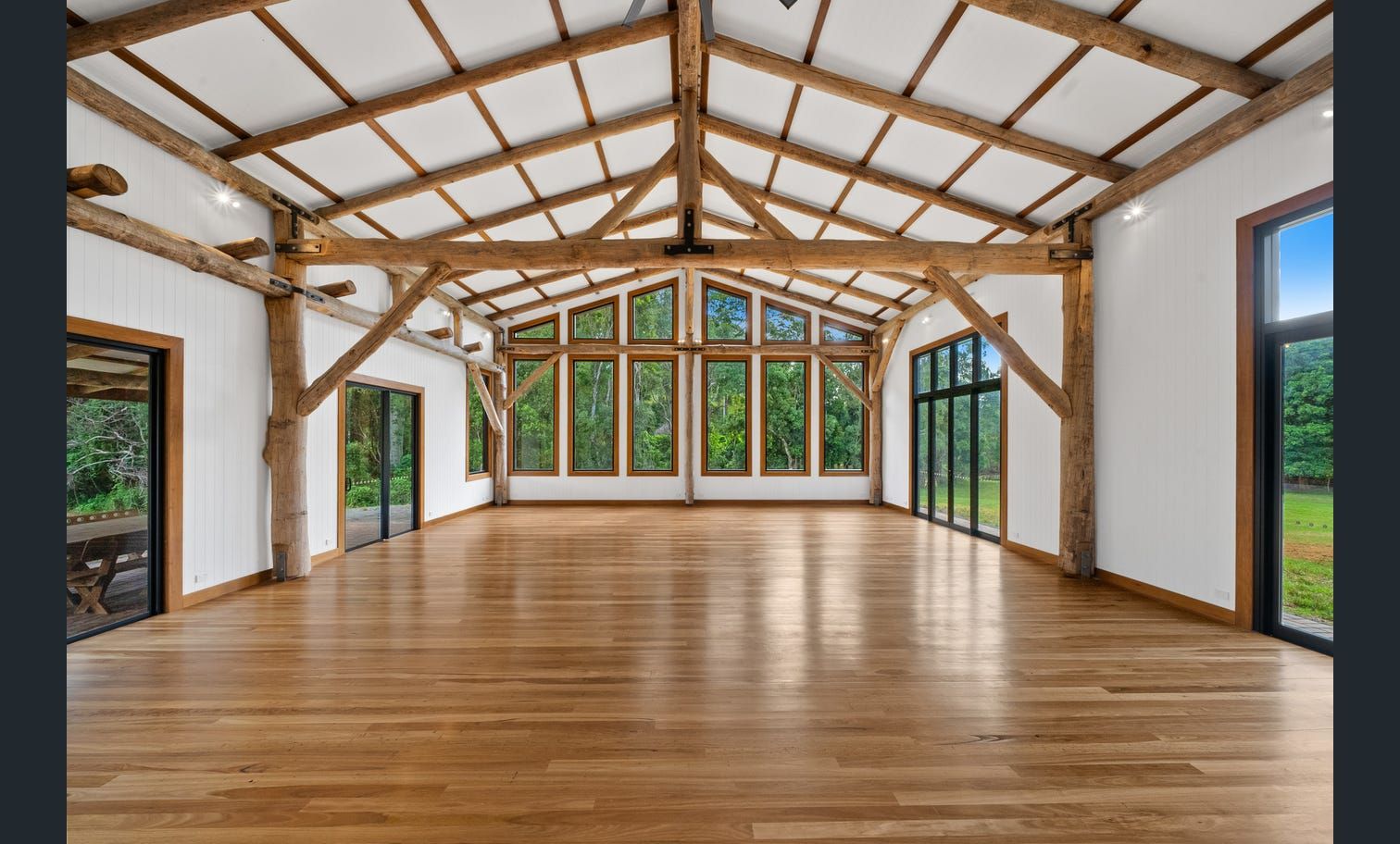 Spacious empty hall with wood floors — Datco Windows & Doors Pty Ltd In South Murwillumbah, NSW