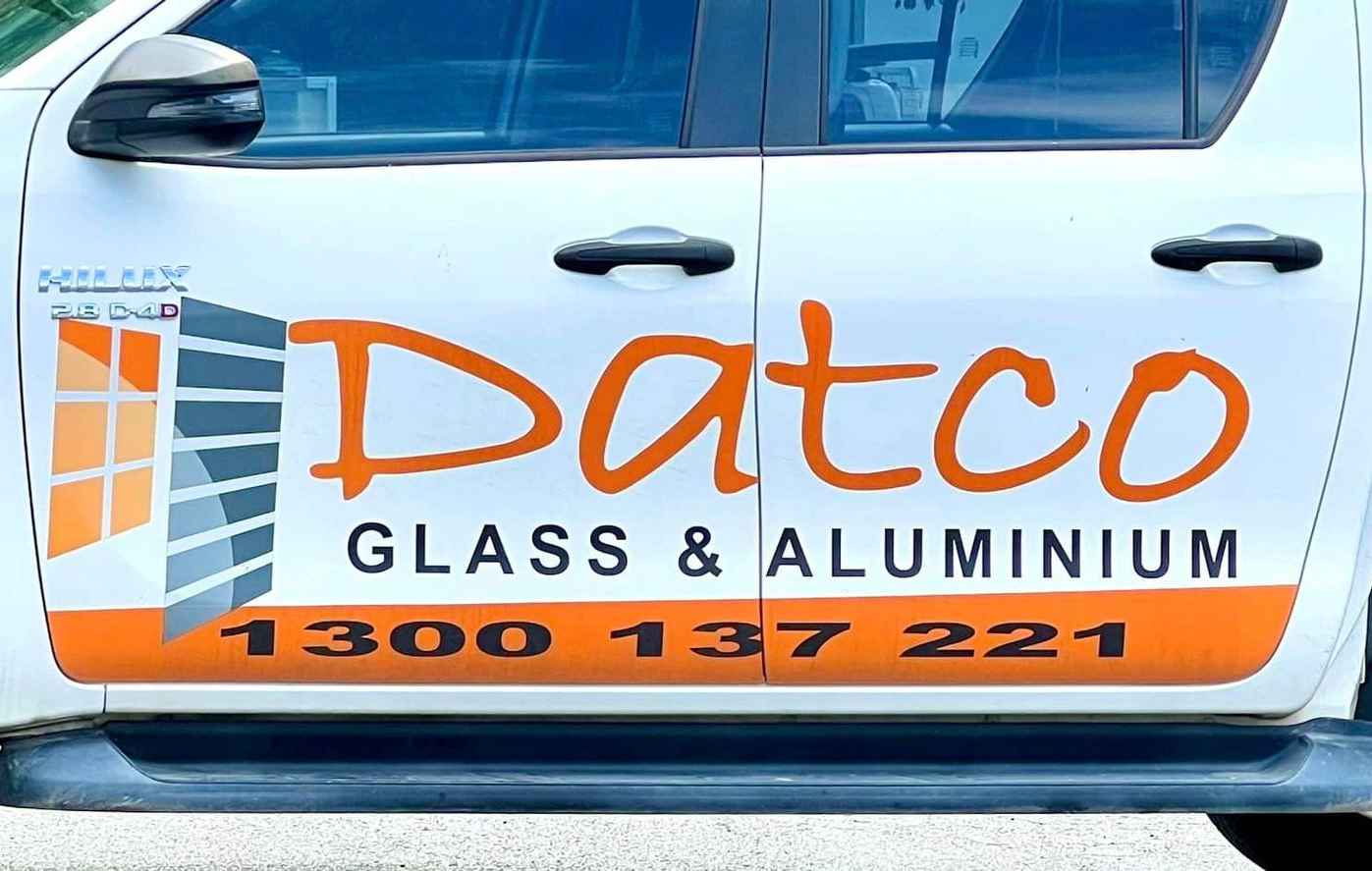 White van door with a logo and phone number — Datco Windows & Doors Pty Ltd In South Murwillumbah, NSW