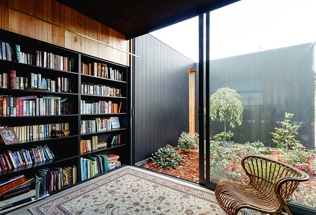 Modern room with a large glass wall opening to a courtyard garden — Datco Windows & Doors Pty Ltd In South Murwillumbah, NSW
