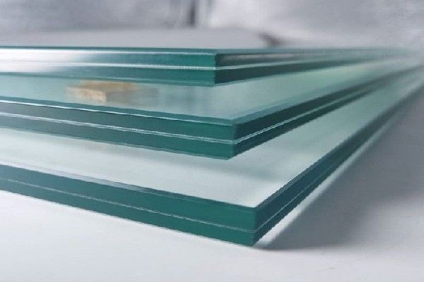 Three Pieces of Glass Are Stacked on Top of Each Other on a Table — Datco Windows & Doors Pty Ltd In South Murwillumbah, NSW