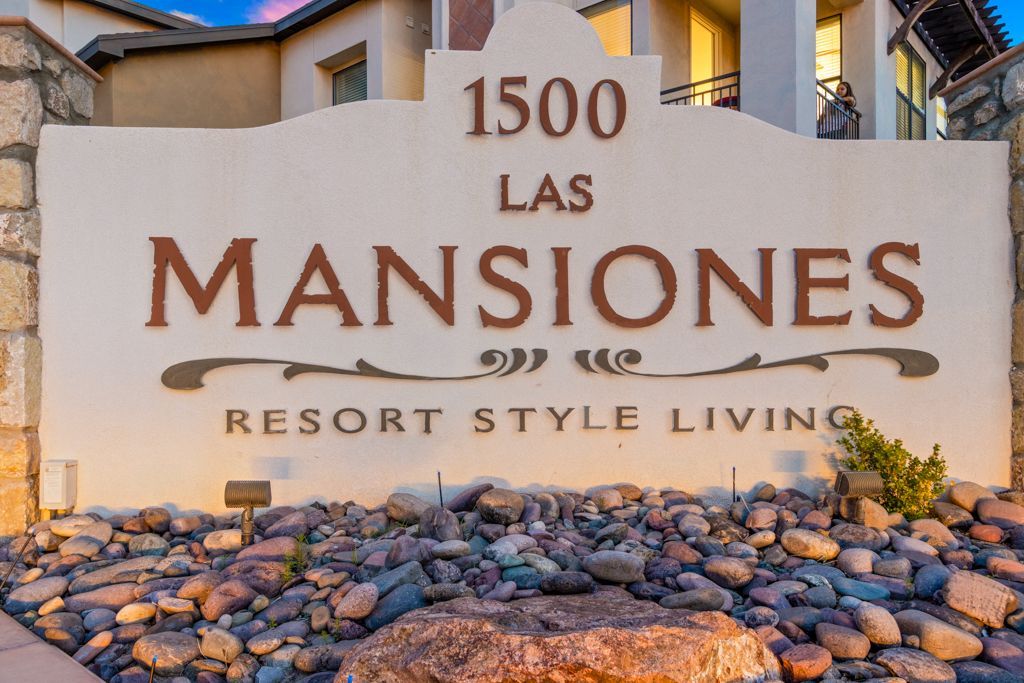 A white sign that says 1500 las mansiones resort style living