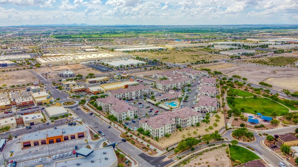 An aerial view of a city with a lot of buildings and a park.
