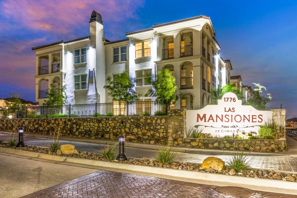 A large building with a sign in front of it that says las mansiones.