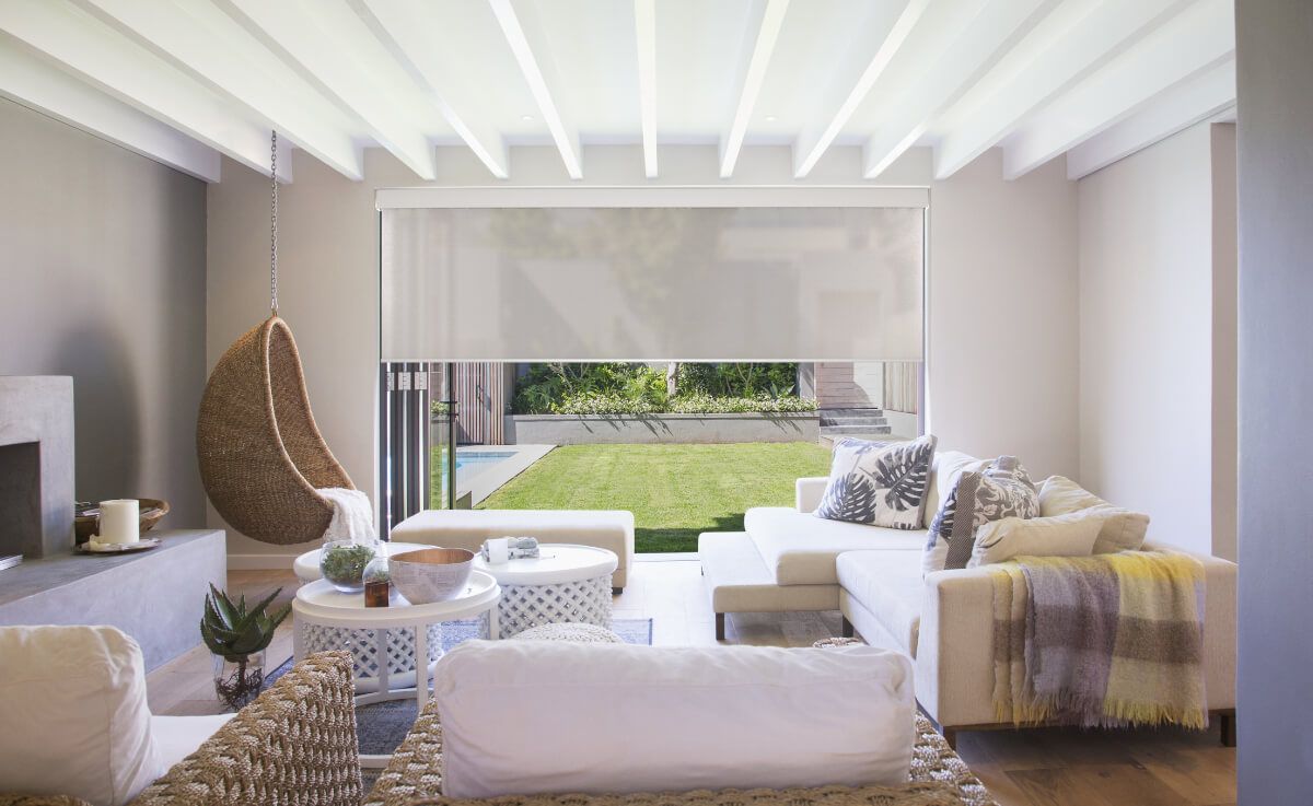A living room with a lot of furniture and a large window