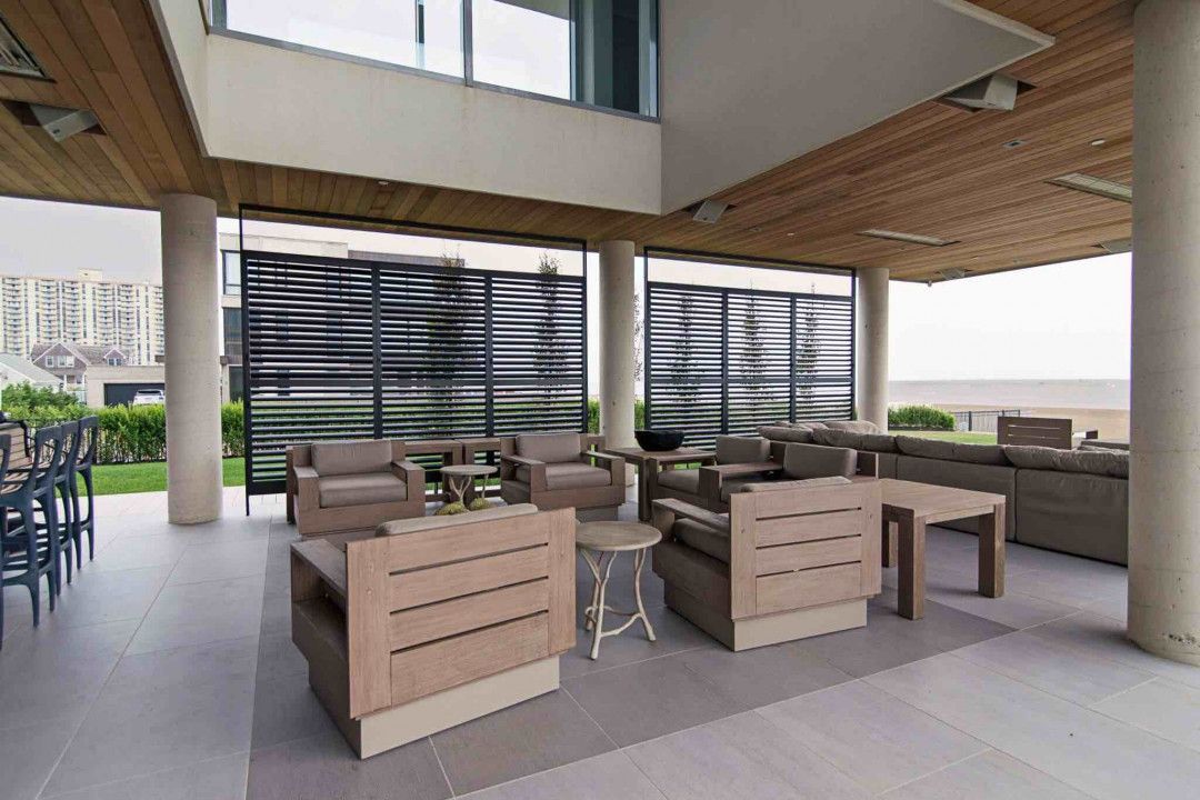 a living room with a lot of furniture and a large window