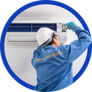 Technician in blue uniform inspecting a wall-mounted air conditioner with a smartphone