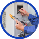 Electrician testing wiring in an electrical panel with a multimeter and probes