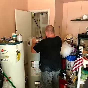 A man fixing water heater