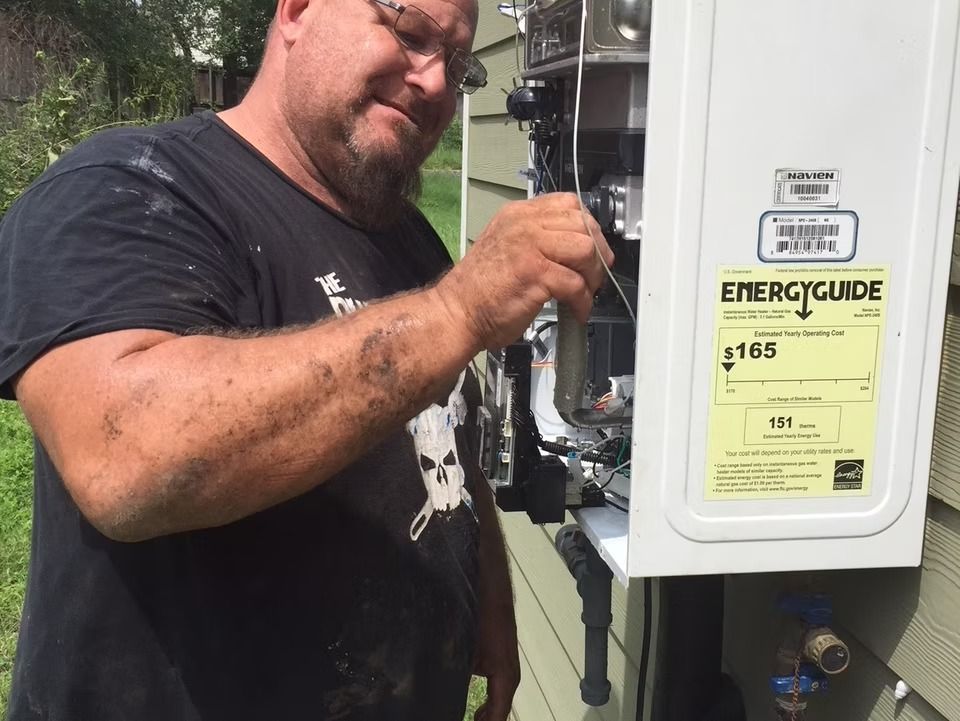 An image of expert technician repairing water heater