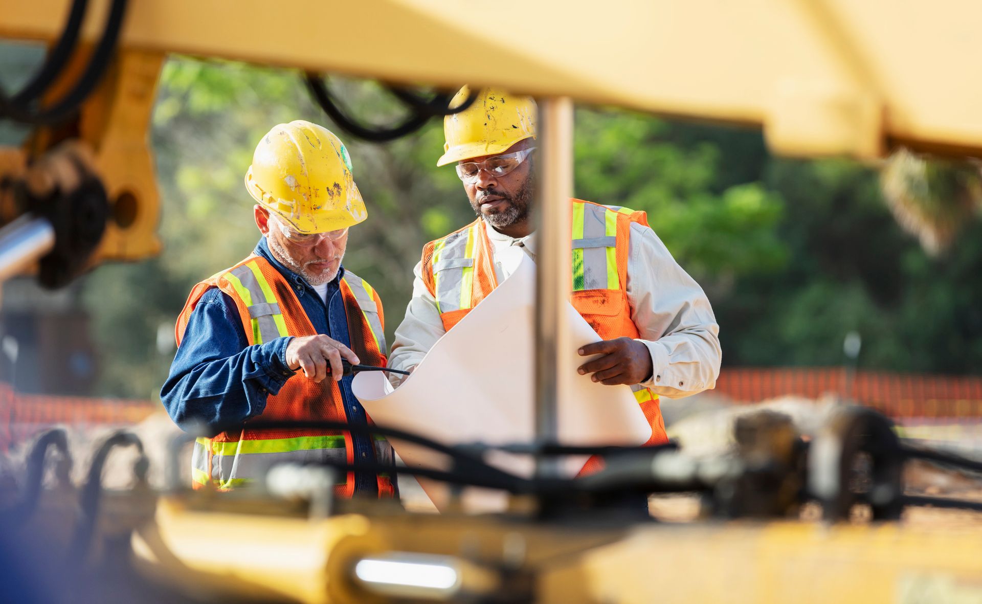 Men Looking At Paperwork Near Tractor Trailer | Brandon, MS - McGraw Rental & Supply