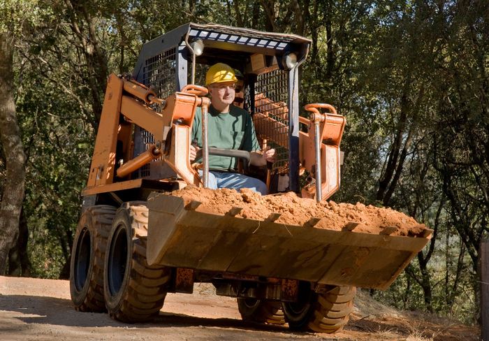 Man Using Heavy Machine — Ridgeland, MS — McGraw Rental & Supply Man Using Heavy Machine — Ridgeland, MS — McGraw Rental & Supply