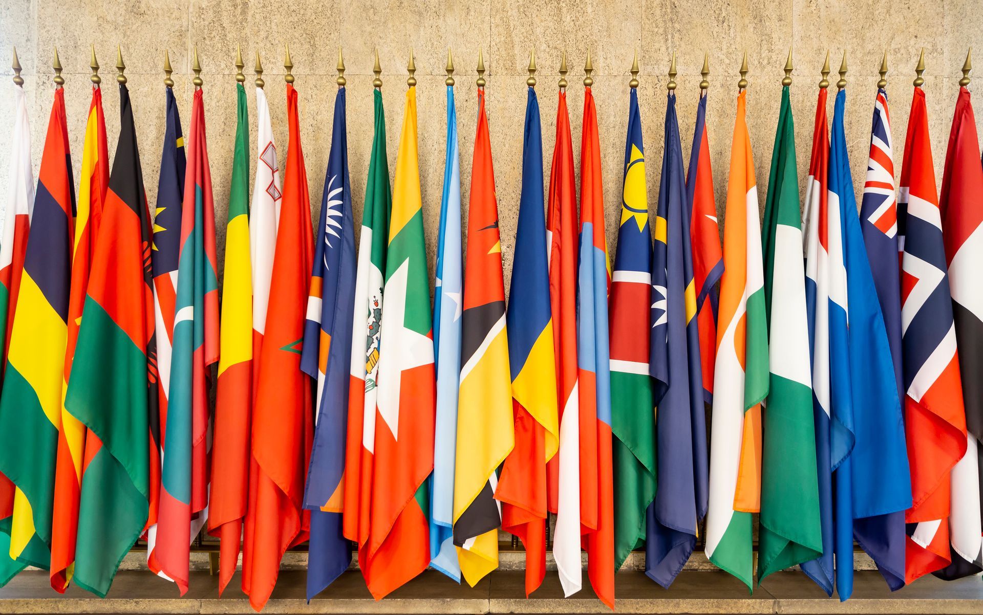 A line of world flags, placed on poles