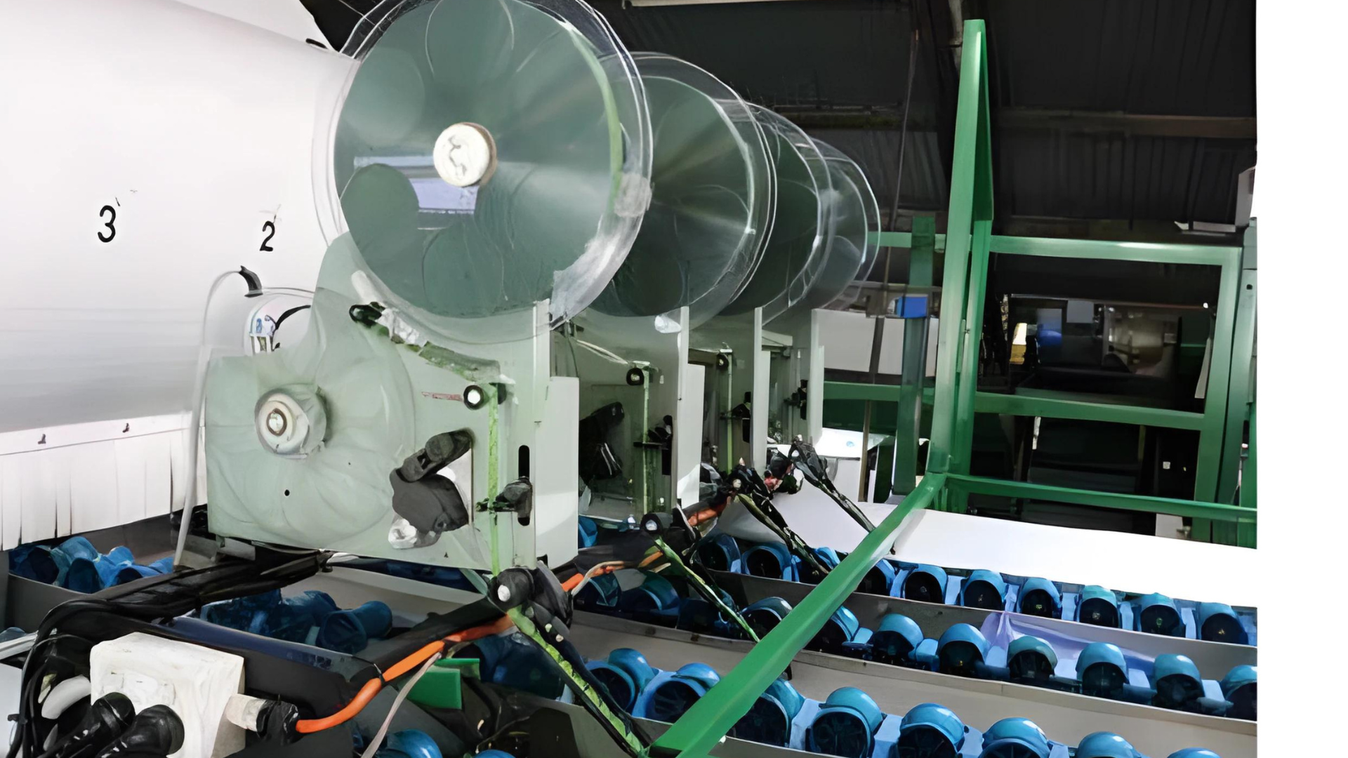 A machine is sitting on a conveyor belt in a factory.