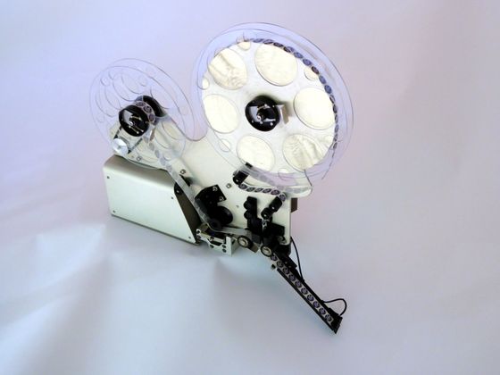 A close up of a machine that looks like a film reel