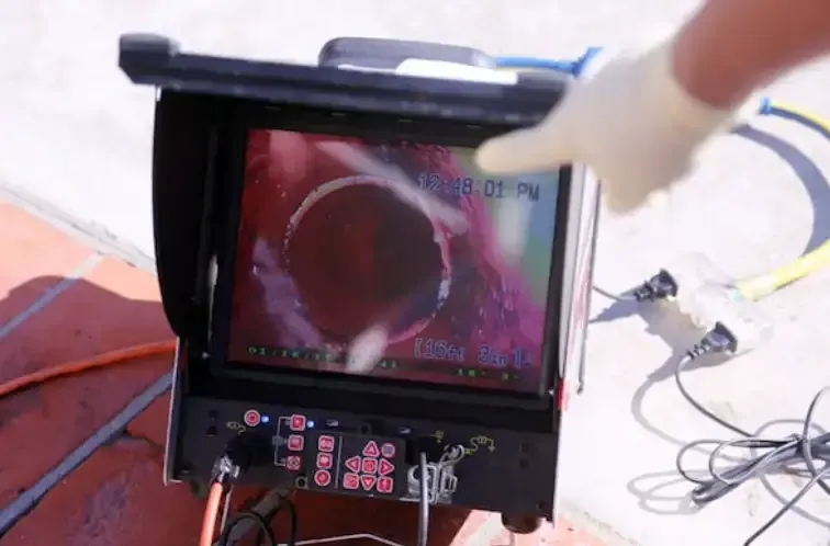 A Person is Using a Camera to Look at a Pipe — Jet 'N' Drain Pty Ltd In Kawungan, QLD