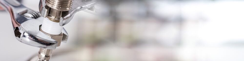 A Close Up of a Pair of Pliers Holding a Drill Bit — Jet 'N' Drain Pty Ltd In Kawungan, QLD