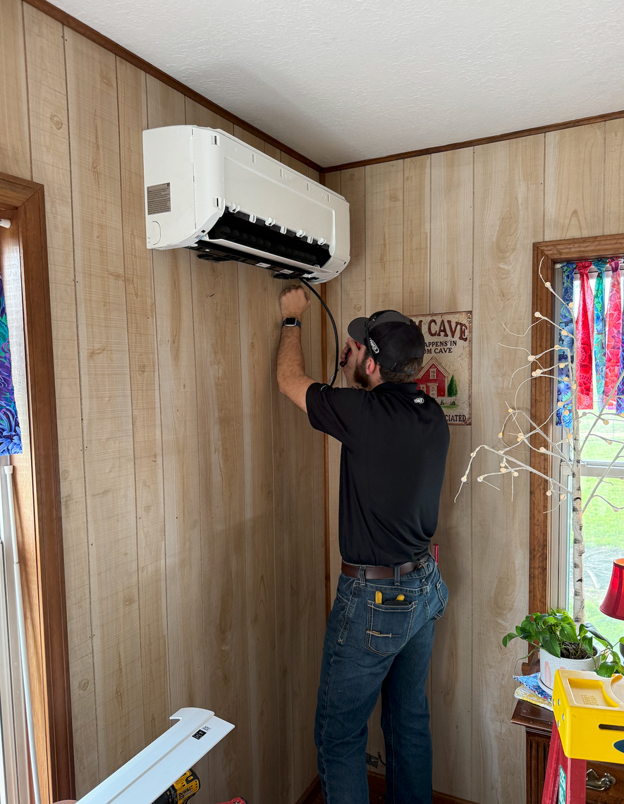 ECOPro technician consulting with homeowner over energy documents