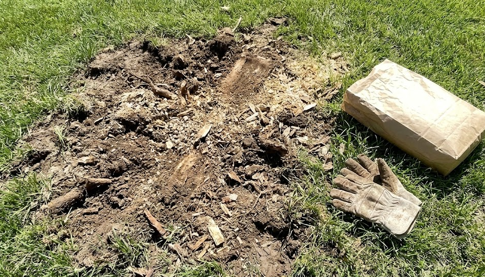 Fresh topsoil and grass seed ready to be planted after a successful tree stump removal.