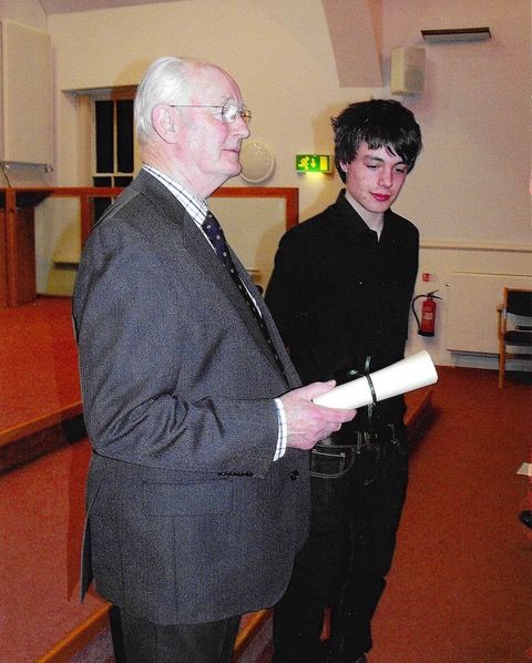 Morpeth Music Society 2010 MMS scholarship winner David Forbes receiving cheque from MMS President Ian Armstrong