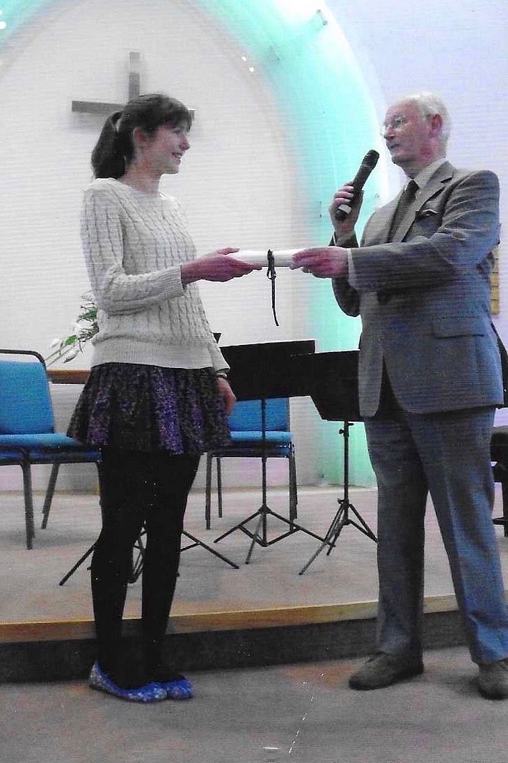 Morpeth Music Society 2012 MMS scholarship winner Rachael Steel receiving cheque from MMS President Ian Armstrong