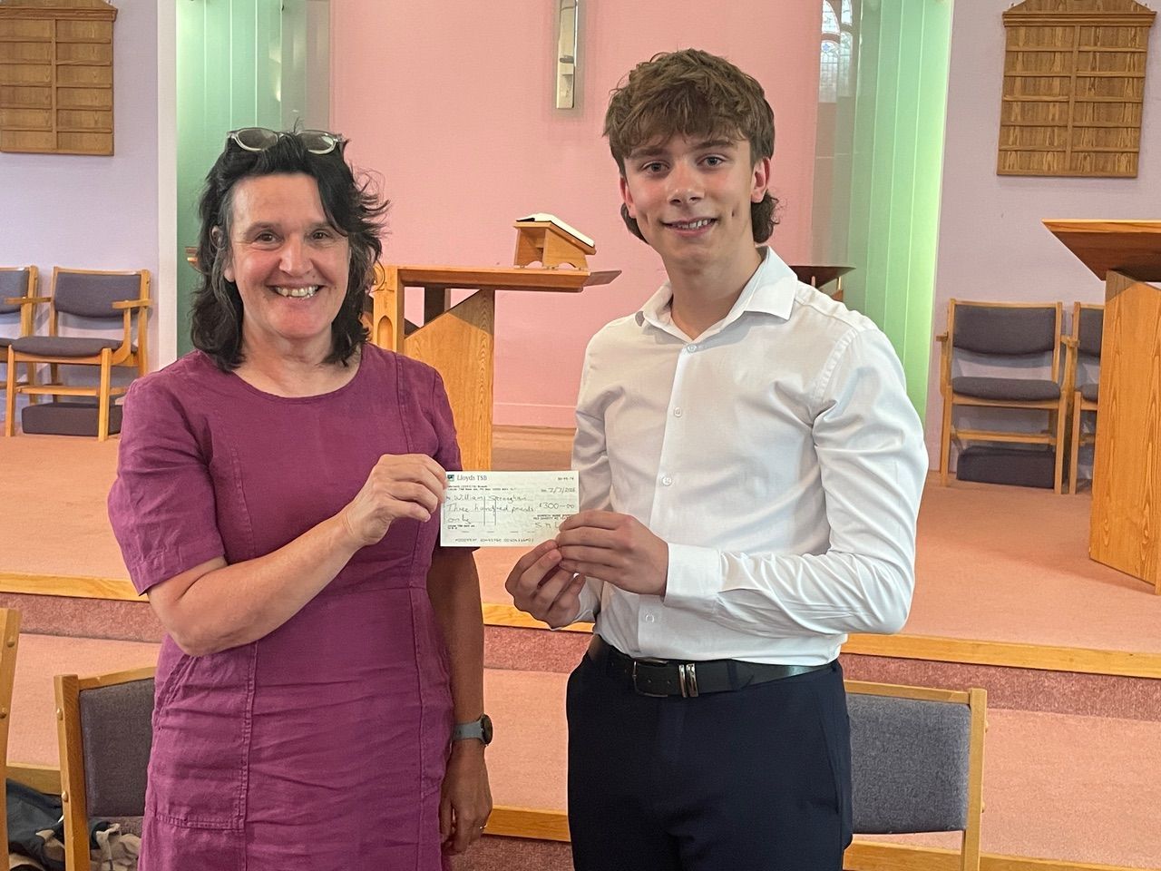 Morpeth Music Society 2026 MMS chair Wendy Locks presenting the scholarship cheque to Will Straughan