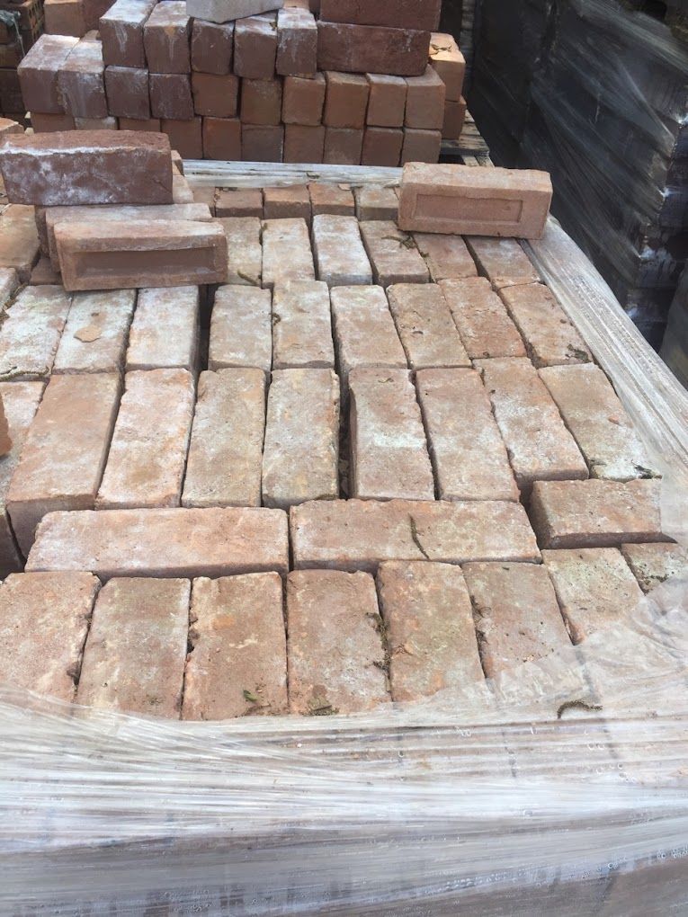 A pile of bricks sitting on top of a wooden table.