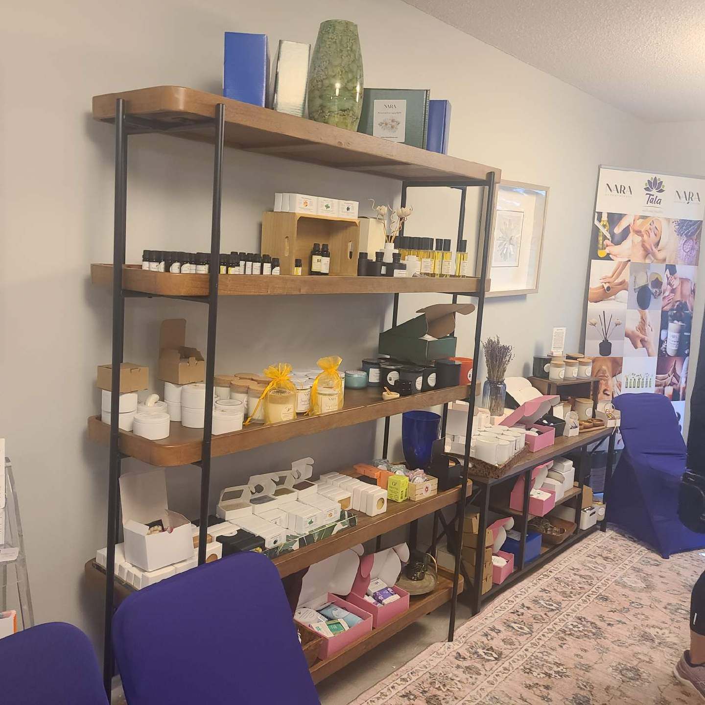Skincare and wellness products displayed on wooden shelves at Marija's Summerville, SC studio