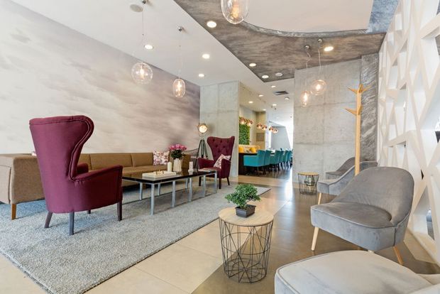 Modern Lounge With Burgundy Chairs — Cachia Upholstery in Tuncurry, NSW