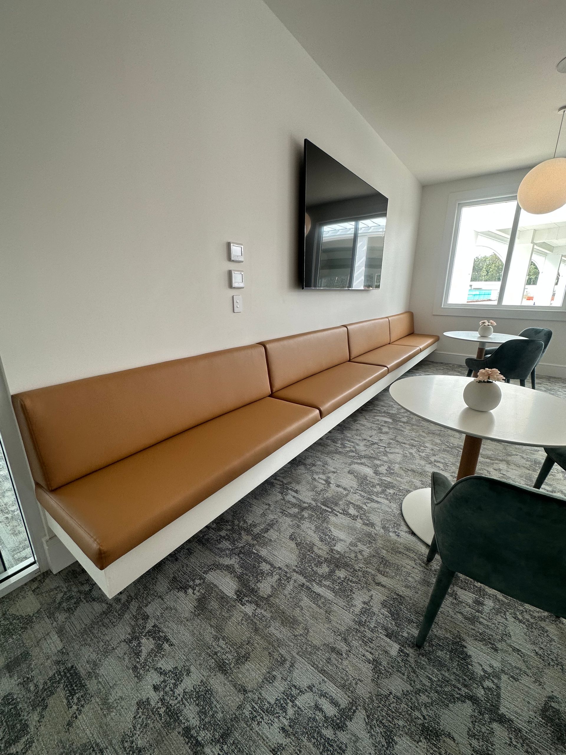 A Living Room with A Couch, Table, and Television — Cachia Upholstery in Nabiac, NSW