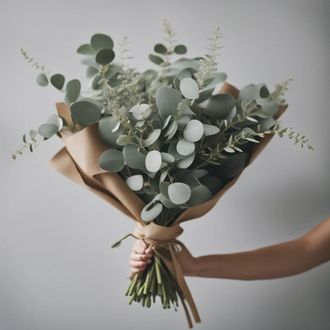 A vase filled with white roses and yellow flowers on a black background.