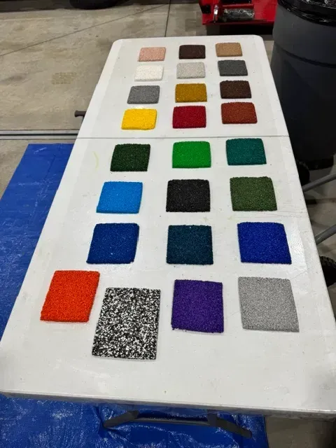 Colorful rubber surfacing swatches on a table