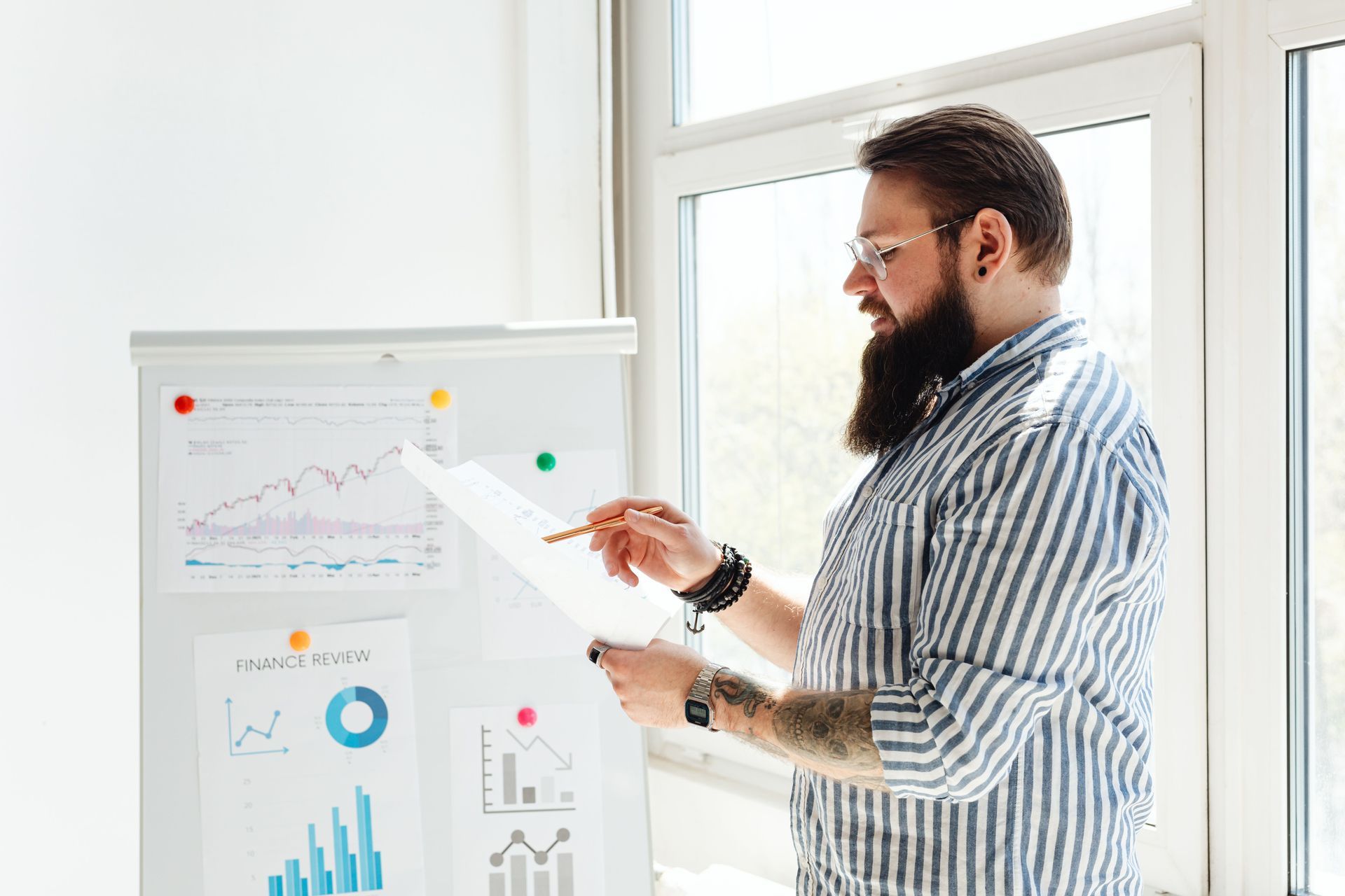 Digital Arm Marketing strategist reviewing keyword research