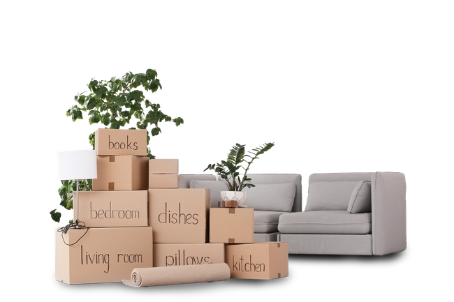 A stack of cardboard boxes sitting next to a couch