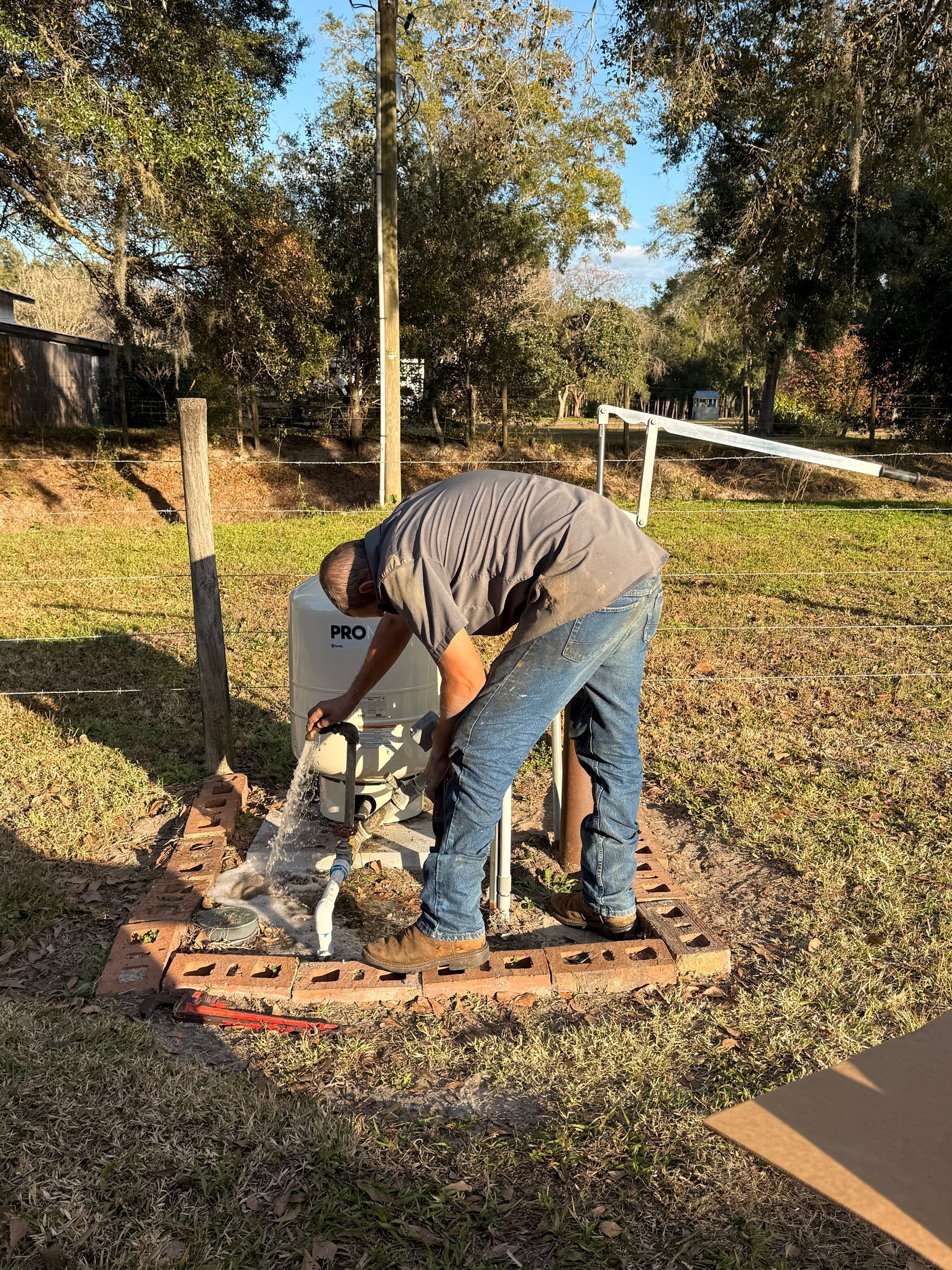 Flushing and testing a pressure tank system