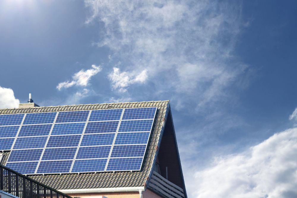 Blue Solar Panels on a Rooftop Under a Bright Cloudy Sky — Edmonton Battery Centre in Gordonvale, QLD