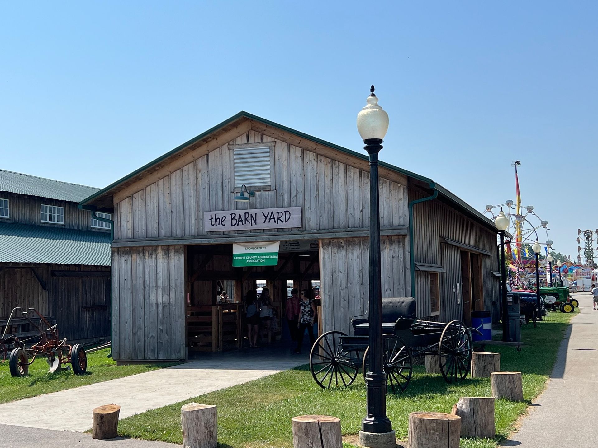 A rustic wooden barn labeled 