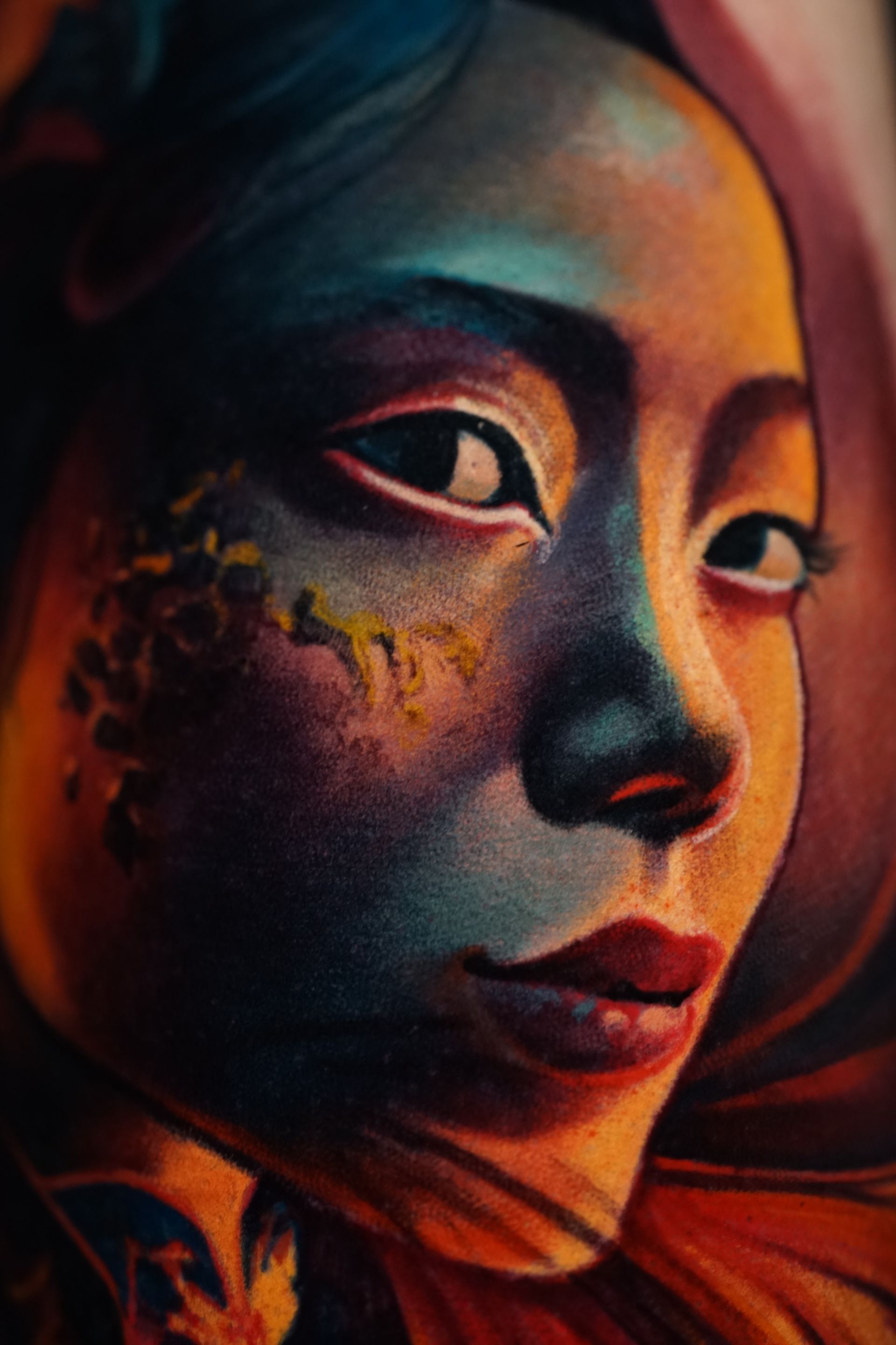 A close up of a woman 's face in a painting.