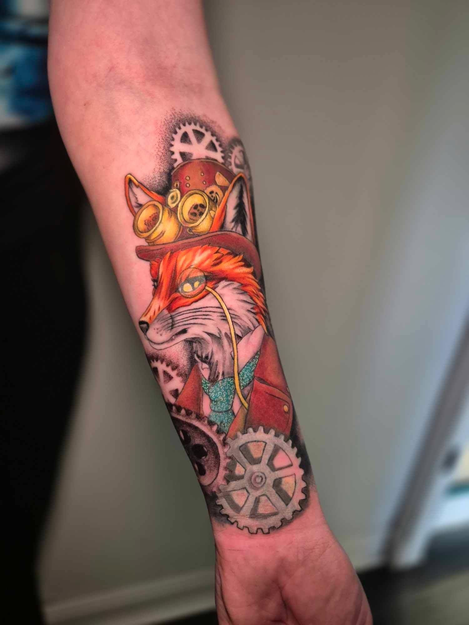 A tattoo of a pikachu and a light bulb on a person 's arm