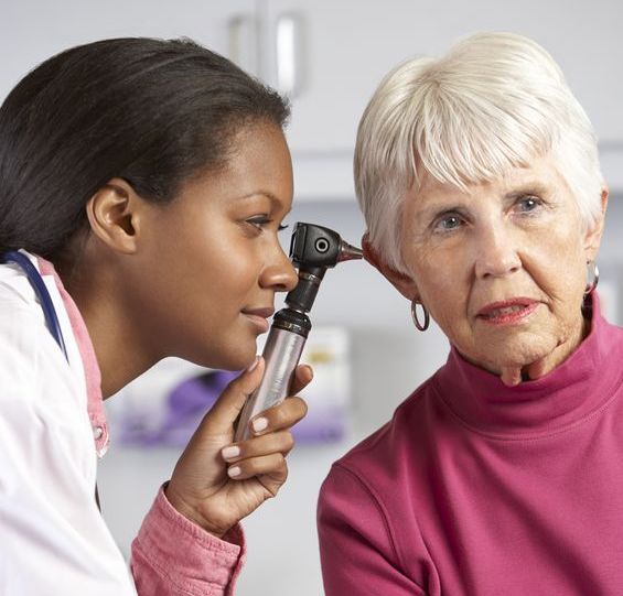 doctor examining patient's ear