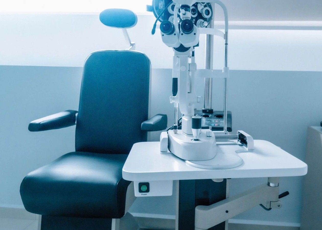 Dental exam chair with attached equipment in a clean clinic room