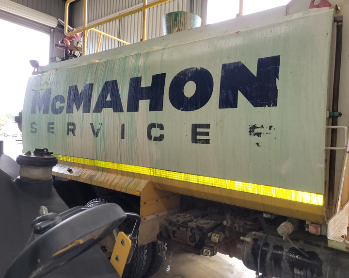 A truck with the word mcmahon on the side of it