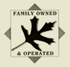 “Family owned & operated” sign with a black leaf silhouette on a beige background
