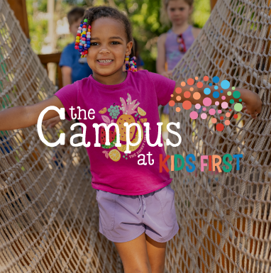 A little girl wearing a pink shirt that says the campus at kids first