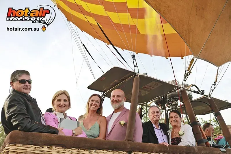 A Group of People Are Sitting in a Hot Air Balloon โ GinaS Cairns Tropical Weddings in Parramatta Park, QLD