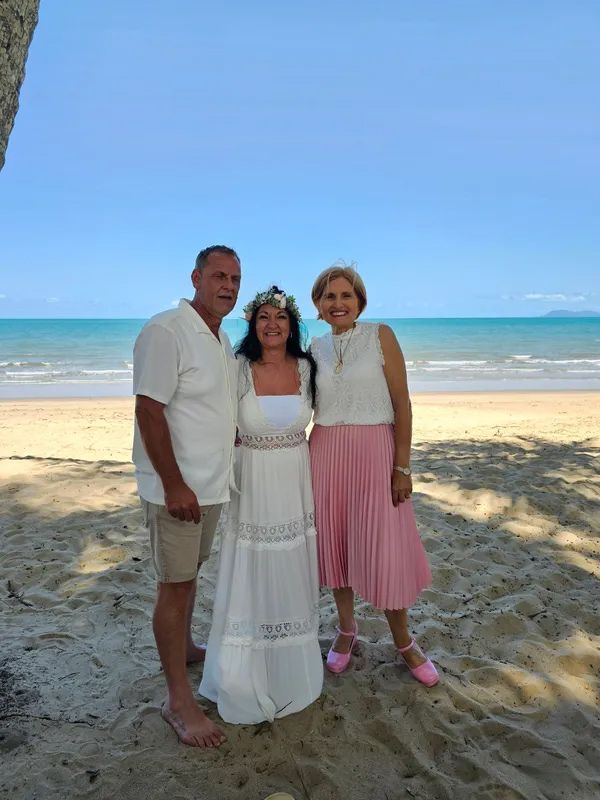 A Group of People Are Posing for a Picture on a Beach — GinaS Cairns Tropical Weddings in Parramatta Park, QLD