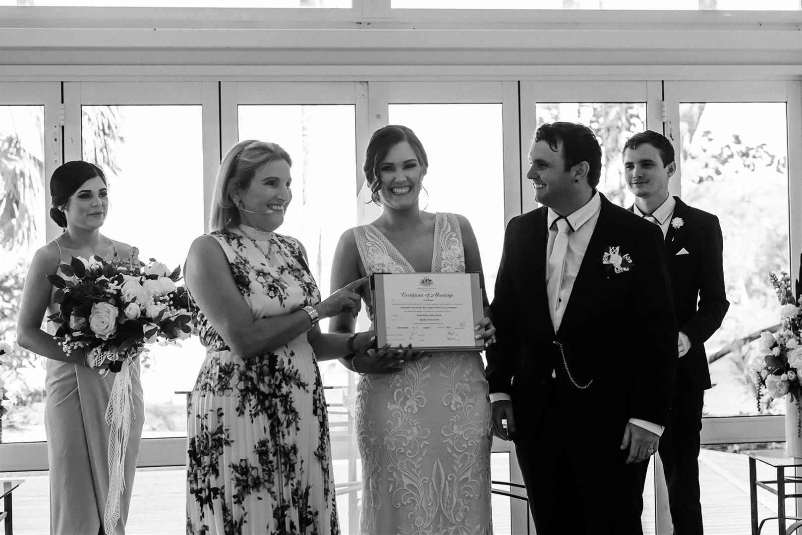 A Bride and Groom Are Holding Hands During Their Wedding Ceremony — GinaS Cairns Tropical Weddings in Parramatta Park, QLD