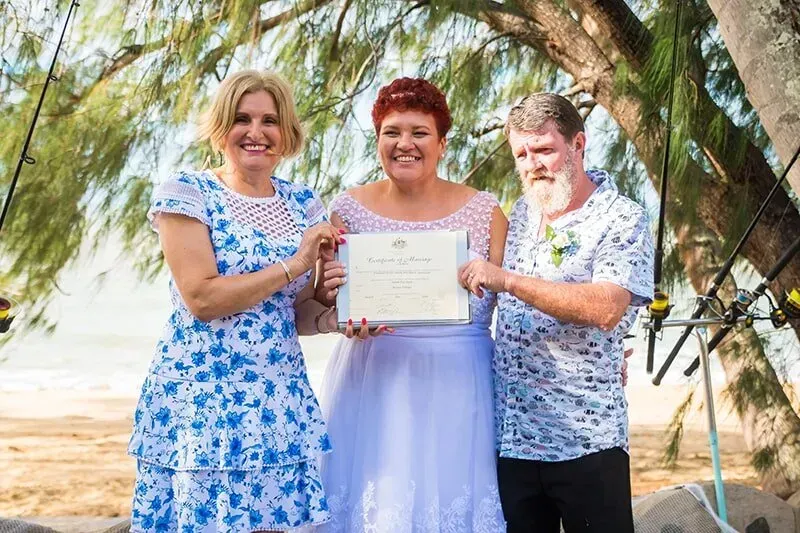 A Group of People Standing Next to Each Other Holding a Certificate โ GinaS Cairns Tropical Weddings in Parramatta Park, QLD