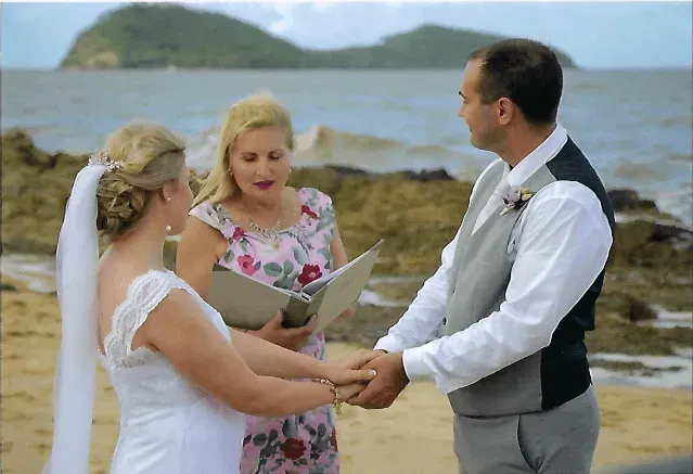 A Bride and Groom During Their Wedding on the Beach โ GinaS Cairns Tropical Weddings in Parramatta Park, QLD