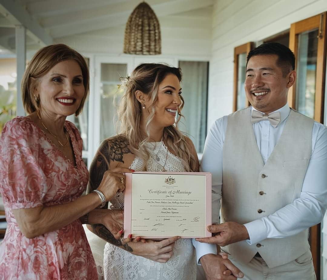 A Bride and Groom Are Posing for a Picture on Their Wedding Day โ GinaS Cairns Tropical Weddings in Parramatta Park, QLD