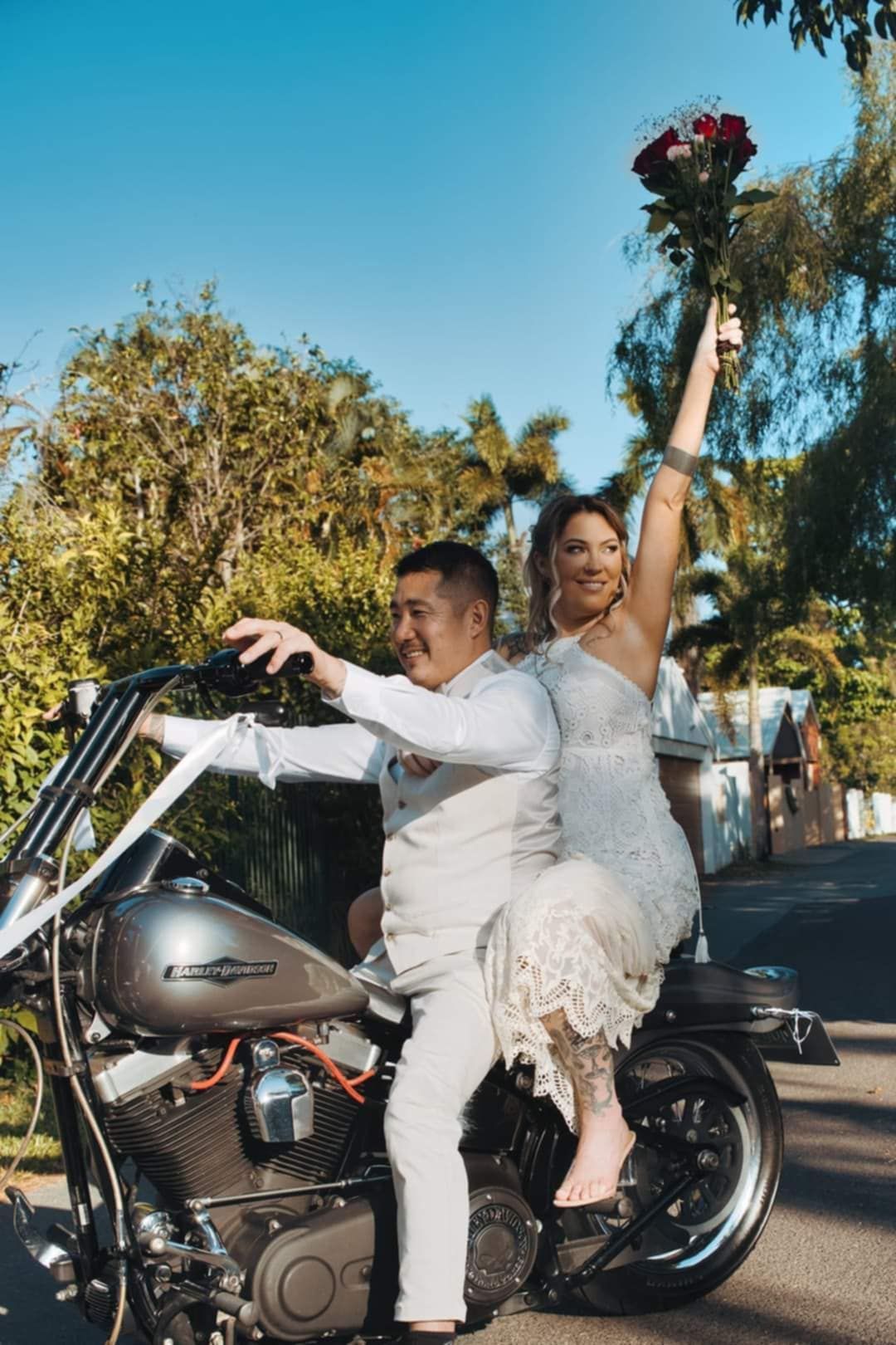 A Bride and Groom Are Posing for a Picture on Their Wedding Day โ GinaS Cairns Tropical Weddings in Parramatta Park, QLD